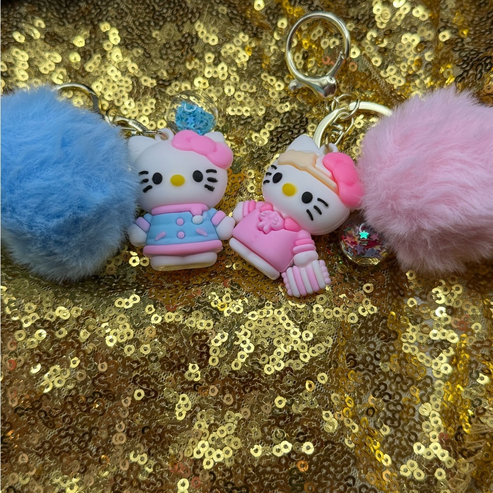 Sanrio Hello Kitty Keychains with Blue and Pink Pom Poms